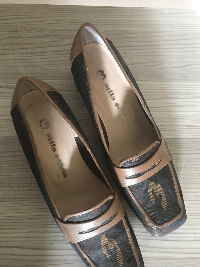 Mila Schön Loafers - Size 6 (Category: Loafers) located in Pasig City. Submitted by mieldecluttersss (Listing ID 1428652621, Image 2). Description: These Mila Schön loafers feature a brown and black design. The shoes are size 6 and made in Japan. The interior of the shoes is marked with the brand name. The soles show some wear. The loafers have a classic loafer design with a square toe..