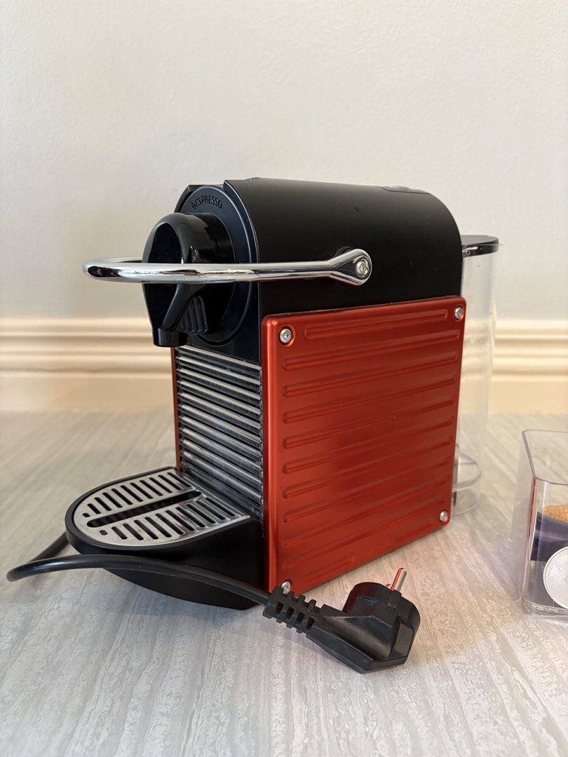Nespresso Pixie Coffee Machine with Capsules (Category: Coffee Machines & Makers) located in Manila. Submitted by keepingthingsclean (Listing ID 1428681546, Image 2). Description: Nespresso Pixie Red Slightly used over a year Mint condition No issue/ no damages Complete with box Capsules included (container of capsules not included) No low ballers please RFS: Upgraded Location: Ortigas.