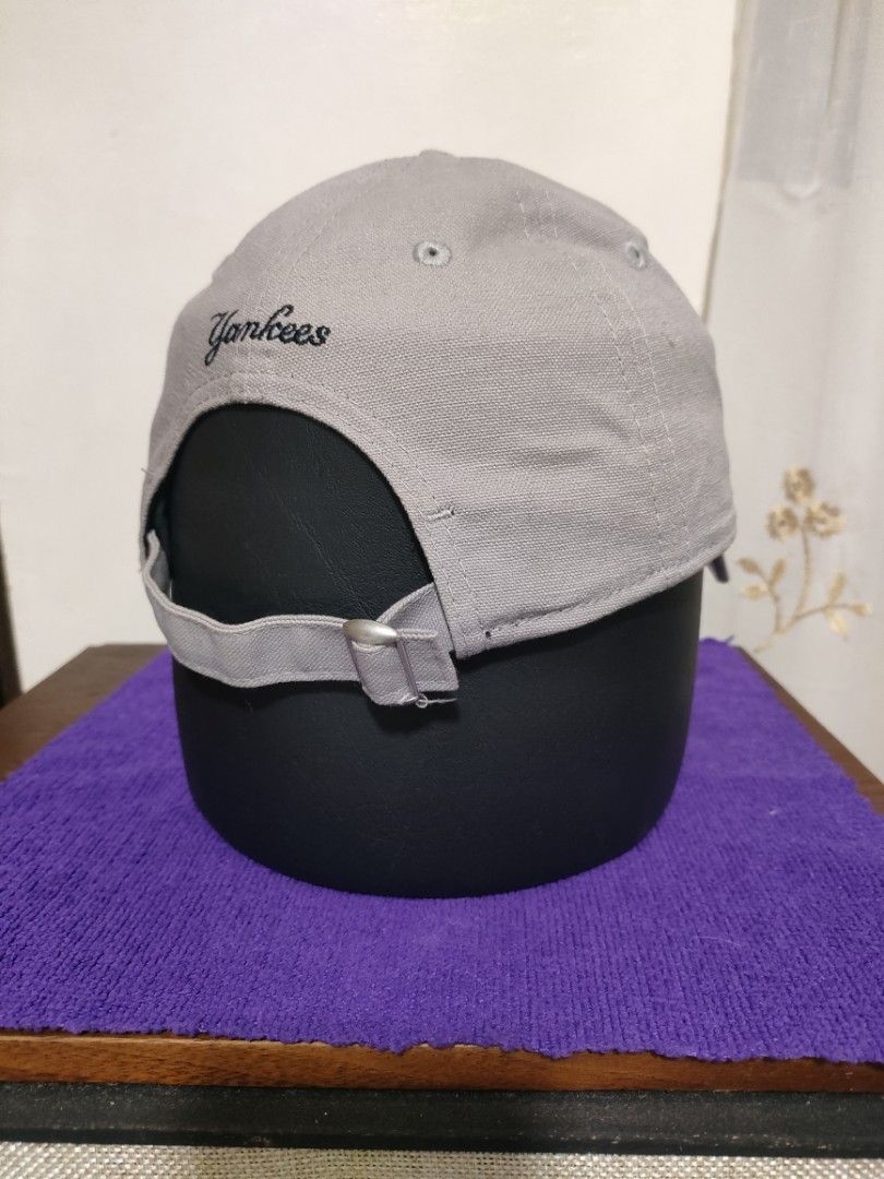 New Era New York Yankees Cap (Category: Caps & Hats) located in Santa Rosa. Submitted by abj_104 (Listing ID 1428616209, Image 3). Description: Gray New Era cap featuring the New York Yankees logo. The cap has the New Era logo on the side and "Yankees" embroidered on the back. It has an adjustable strap for a comfortable fit. Old stock, unused.