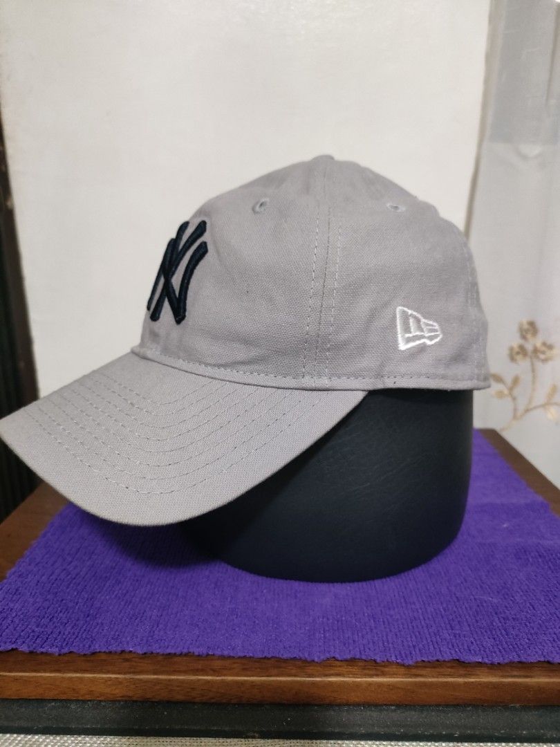 New Era New York Yankees Cap (Category: Caps & Hats) located in Santa Rosa. Submitted by abj_104 (Listing ID 1428616209, Image 2). Description: Gray New Era cap featuring the New York Yankees logo. The cap has the New Era logo on the side and "Yankees" embroidered on the back. It has an adjustable strap for a comfortable fit. Old stock, unused.