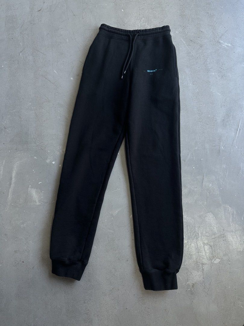 Off-White Gradient Arrow Sweatpants (Category: Joggers) located in Santa Rosa. Submitted by archivedrip (Listing ID 1428683940, Image 1). Description: Black Off-White sweatpants with gradient arrow design on the back. Features a drawstring waist and the Off-White logo on the front. Made in Portugal. Size S. Fabric is 100% cotton. Includes care instructions and the Off-White label. W : 26 to 30 L : 45.