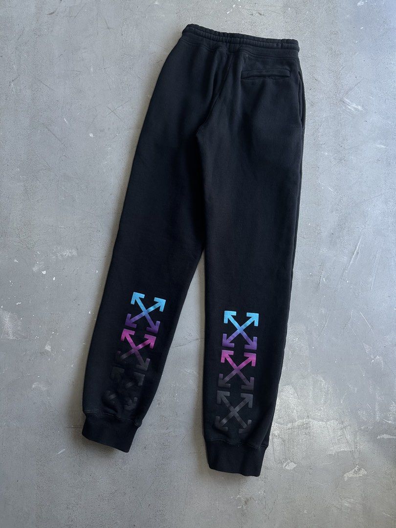 Off-White Gradient Arrow Sweatpants (Category: Joggers) located in Santa Rosa. Submitted by archivedrip (Listing ID 1428683940, Image 2). Description: Black Off-White sweatpants with gradient arrow design on the back. Features a drawstring waist and the Off-White logo on the front. Made in Portugal. Size S. Fabric is 100% cotton. Includes care instructions and the Off-White label. W : 26 to 30 L : 45.