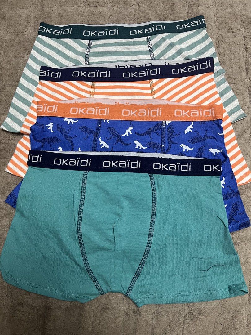 Okaidi Boxer Briefs - Assorted Designs (Category: Babies & Kids Fashion) located in Paranaque City. Submitted by princessann0721 (Listing ID 1428758686, Image 1). Description: Set of Okaidi boxer briefs in various colors and patterns. Includes striped and dinosaur print designs. The waistband features the Okaidi logo. These boxer briefs appear to be made of a soft, comfortable material. Perfect for everyday wear. Avail Sizes: 4A, 6A, 8A, 10A, 12A