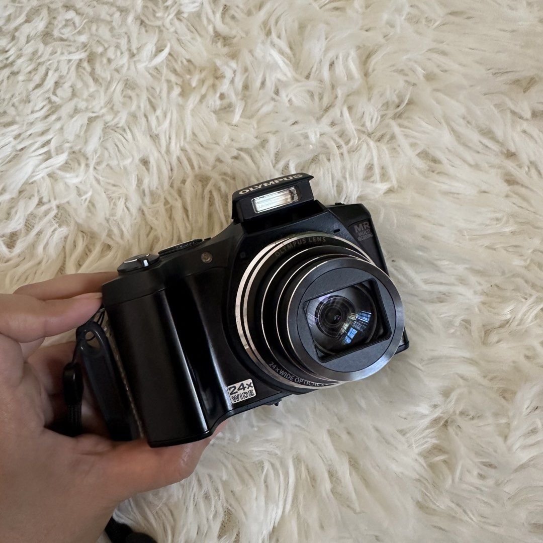 Olympus SZ-31MR 16MP Digital Camera (Category: Cameras) located in Manila. Submitted by helpmedeclutter07 (Listing ID 1428651638, Image 2). Description: Olympus SZ-31 MR ₱6,800.00 💕16 megapixels + 24x optical zoom 💕touch screen 💕can take pictures, can take videos (Full HD 1080р) 💕pop-up flash 💕fully functional: all buttons, video, flash, zoom working Issues: no battery door Inclusions: -battery -camera strap -32mb sd card -universal charger 