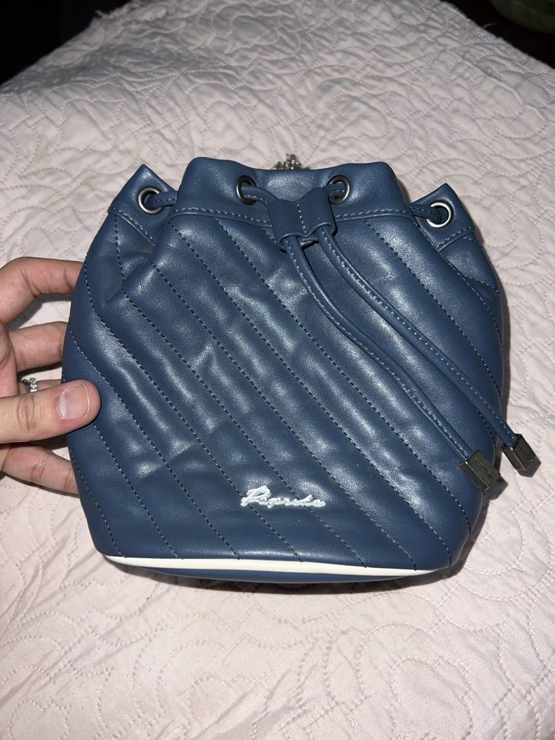 Paprika Blue Bucket Bag with Chain (Category: Cross-body Bags) located in Bulacan. Submitted by thriftstationplus (Listing ID 1428708013, Image 1). Description: Made in Unknown Check their site on FB! ✅ Overall Condition - 9.5/10 💯 % Genuine Leather 🏆Condition of: 🐮Leather - 9.5/10 🪨 Edge Paint - 9.5/10 🛠️Hardwares -9.5/10 ➰Strap/Sling - 8.5/10 (Replaced) 📉Lining/Edges - 9.5/10 🧐Interior - 9.5/10 🔗 Canvas - 7/10 🧬Measurements: * Height: 