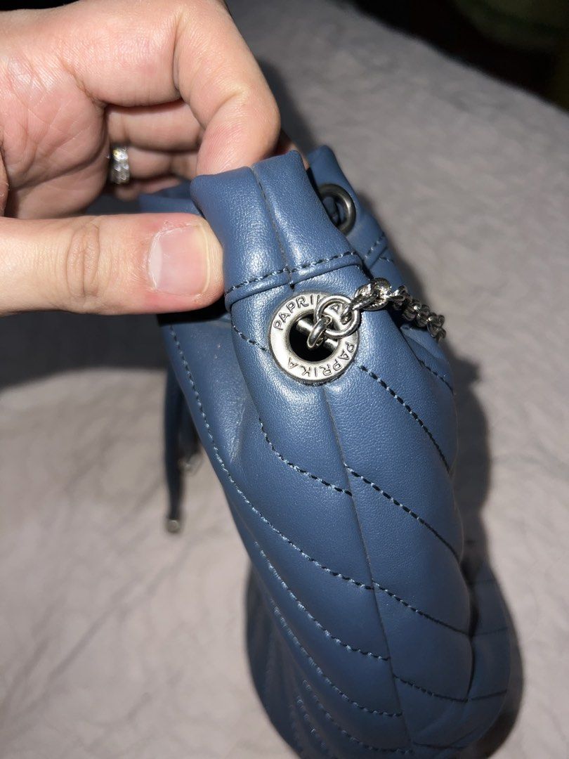 Paprika Blue Bucket Bag with Chain (Category: Cross-body Bags) located in Bulacan. Submitted by thriftstationplus (Listing ID 1428708013, Image 3). Description: Made in Unknown Check their site on FB! ✅ Overall Condition - 9.5/10 💯 % Genuine Leather 🏆Condition of: 🐮Leather - 9.5/10 🪨 Edge Paint - 9.5/10 🛠️Hardwares -9.5/10 ➰Strap/Sling - 8.5/10 (Replaced) 📉Lining/Edges - 9.5/10 🧐Interior - 9.5/10 🔗 Canvas - 7/10 🧬Measurements: * Height: 