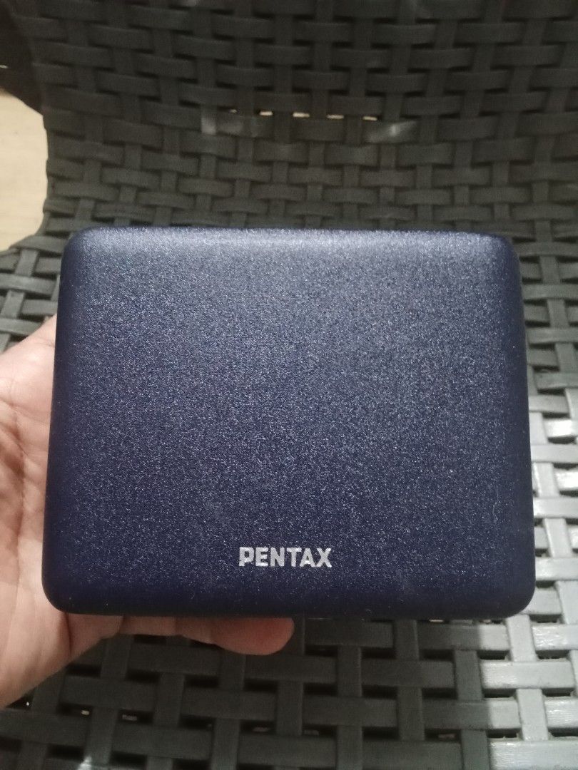 Pentax Case (Category: Camera Bags & Carriers) located in Bocaue. Submitted by marajapansurplus (Listing ID 1428737962, Image 1). Description: Pentax case in a dark blue color. The case has a metallic silver trim and a hinge. The inside of the case is a light green color. The Pentax logo is visible on the front of the case..