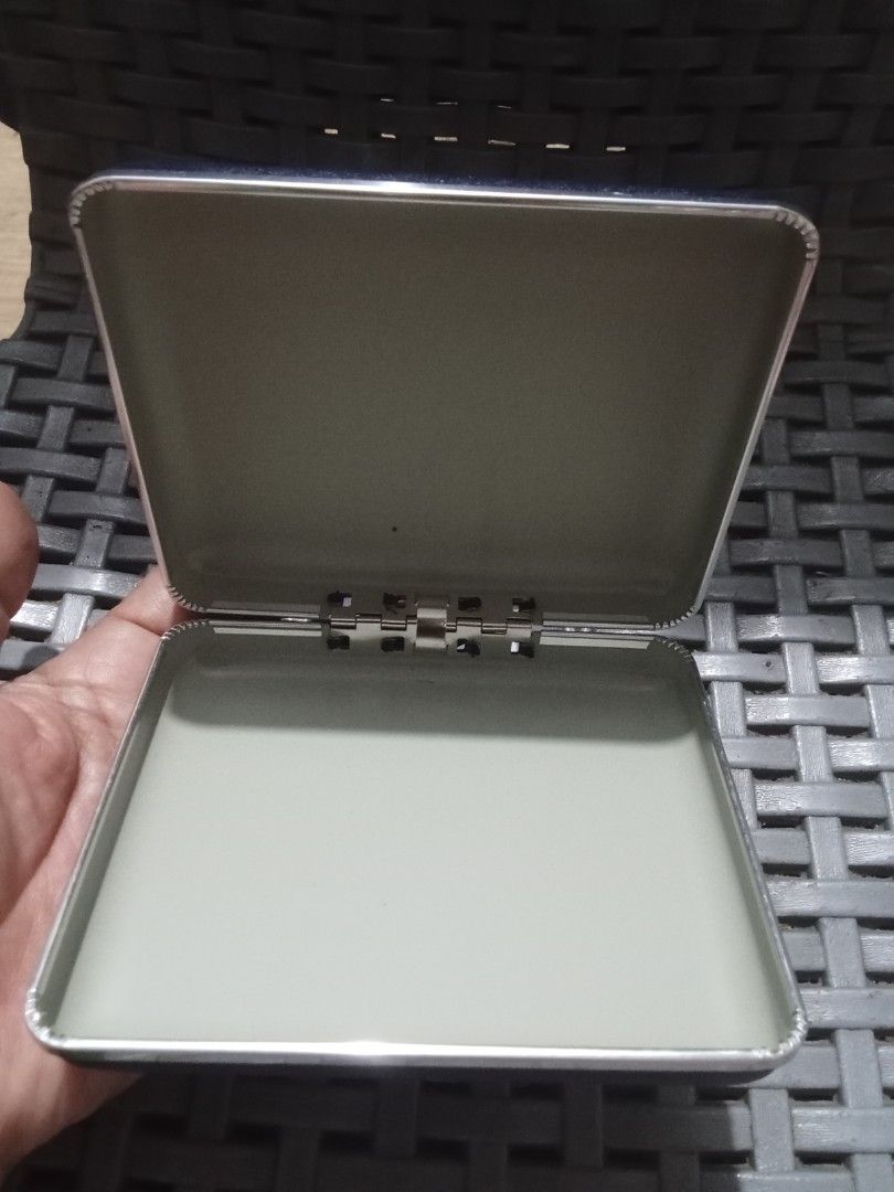 Pentax Case (Category: Camera Bags & Carriers) located in Bocaue. Submitted by marajapansurplus (Listing ID 1428737962, Image 2). Description: Pentax case in a dark blue color. The case has a metallic silver trim and a hinge. The inside of the case is a light green color. The Pentax logo is visible on the front of the case..