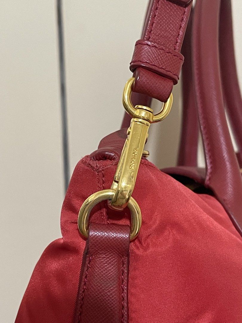 Prada Red Tessuto Saffiano Handbag (Category: Luxury Bags & Wallets) located in Quezon City. Submitted by karjanef (Listing ID 1428697645, Image 3). Description: PRADA Red Tessuto Nylon and Saffianio Leather Tote Bag Single zip closure with magnetic snap closure flap Like new, malinis. Interior Lining: Fine Prada jacquard textile lining Hardware: Goldtone Measurements: 11” L x 7” W x 9.5” H.