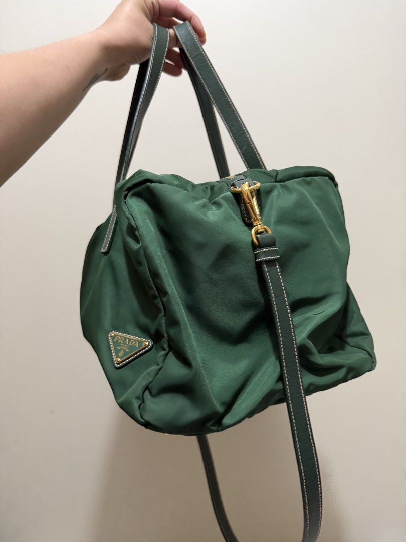 Prada Tessuto + Saffiano Mini Duffle (Category: Luxury Bags & Wallets) located in Pasig City. Submitted by chescaaaaaaa.19 (Listing ID 1428715707, Image 3). Description: Prada Re-Nylon / Tessuto + Saffiano Leather Mini Duffle (bowling bag style) Comes with a dust bag Authentic Very good used condition Detachable strap Super pretty shade of green! Material: Soft padded nylon (Prada’s signature Tessuto / Re-Nylon) • Handles: Structured Saffiano lea