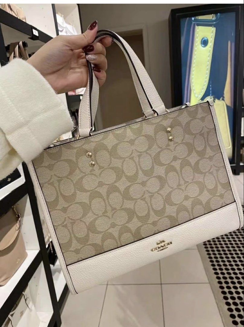 Preloved Coach Dempsey Carryall (Category: Luxury Bags & Wallets) located in Carmona. Submitted by havalook (Listing ID 1428749329, Image 1). Description: Preloved Original bag used Signature Canvas light khaki chalk Snap closure Detachable strap Shoulder/ hand/ crossbody bag Dempsey 30 Refined pebble leather Negotiable Rfs: rarely used.