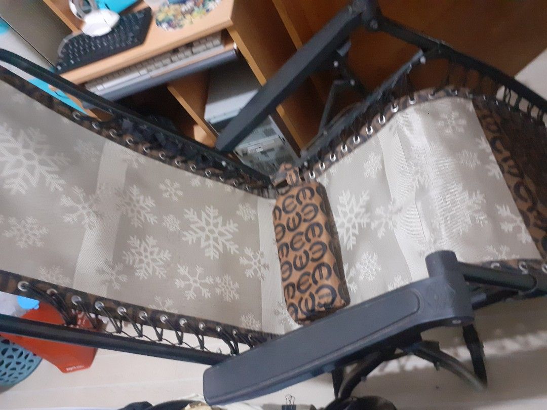 Preloved Zero Gravity Recliner Chair with Snowflake Design (Category: Chairs) located in Lipa City. Submitted by newriver_a7c3ea (Listing ID 1428690128, Image 2). Description: Comfortable zero gravity recliner chair. Features a unique snowflake pattern on the seat and backrest. The chair has a black frame and a headrest pillow. The design on the side of the chair has a repeating pattern. Perfect for relaxing outdoors or indoors. Provides excellen