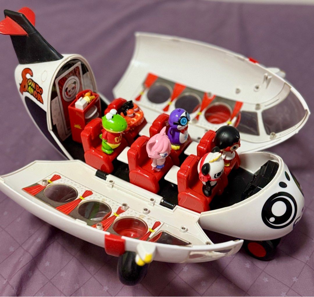 Ryan World’s Combo Panda Airplane Set with 6 Figures (Category: Kids Toys) located in Taguig. Submitted by deklutr_finds (Listing ID 1428655490, Image 2). Description: 1 Airplane 6 Figures complete (1.75 - 2 inch tall plastic figures) Accessories: 1 red trolley, 4 white trays, 1 milk carton, 1 fruit, 1 ice cream, 1 red headphone Storage Feature: Airplane doubles as a storage case when not in play. Rolling Wheels: Functional rolling wheels for eas