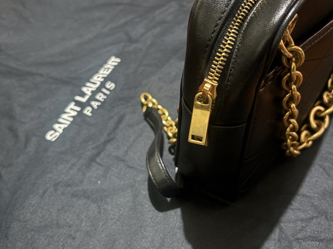 Saint Laurent Camera Chain Bag (Category: Luxury Bags & Wallets) located in Quezon City. Submitted by ellemss (Listing ID 1428757224, Image 3). Description: - Saint Laurent Camera Chain Bag - Classic black color - Complete inclusion. Comes with: dust bag and cards - Gold chain detail - Shoulder bag style - Perfect for everyday use or special occasions.