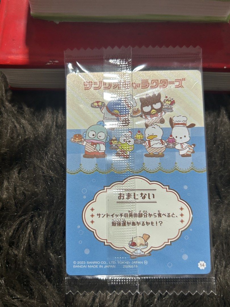 Sanrio Characters Trading Card (Category: Raw Singles) located in Angeles City. Submitted by zyeplustradings (Listing ID 1428632331, Image 2). Description: Sanrio Characters trading card featuring various characters. The card is in its original packaging. The front of the card displays several Sanrio characters with food. The back of the card has Japanese text and more character illustrations. It is a 2023 Sanrio product..
