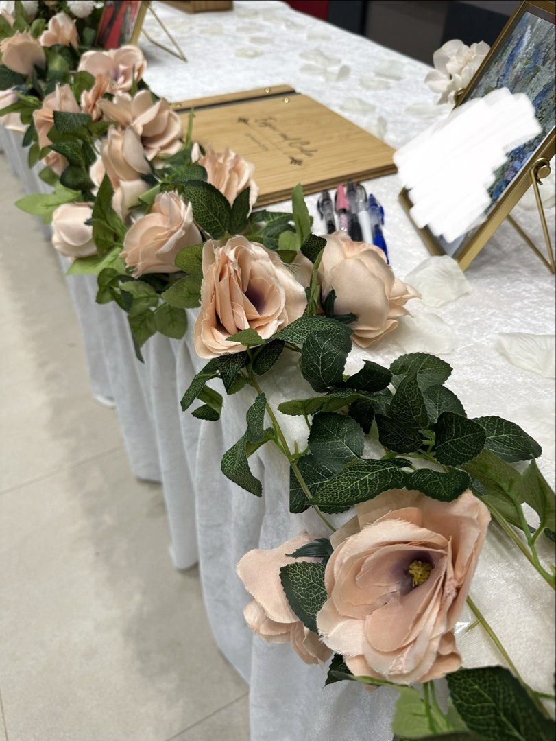 String flowers (Category: Artificial Plants & Flowers) located in Singapore. Submitted by ganster_ (Listing ID 1428643388, Image 2). Description: Used once for wedding only! 1 string has 10 blush pink roses Total 15 pcs *photo shown has 3 strings per table 1 pc = $2.50 Buy all 15 pcs for $35.