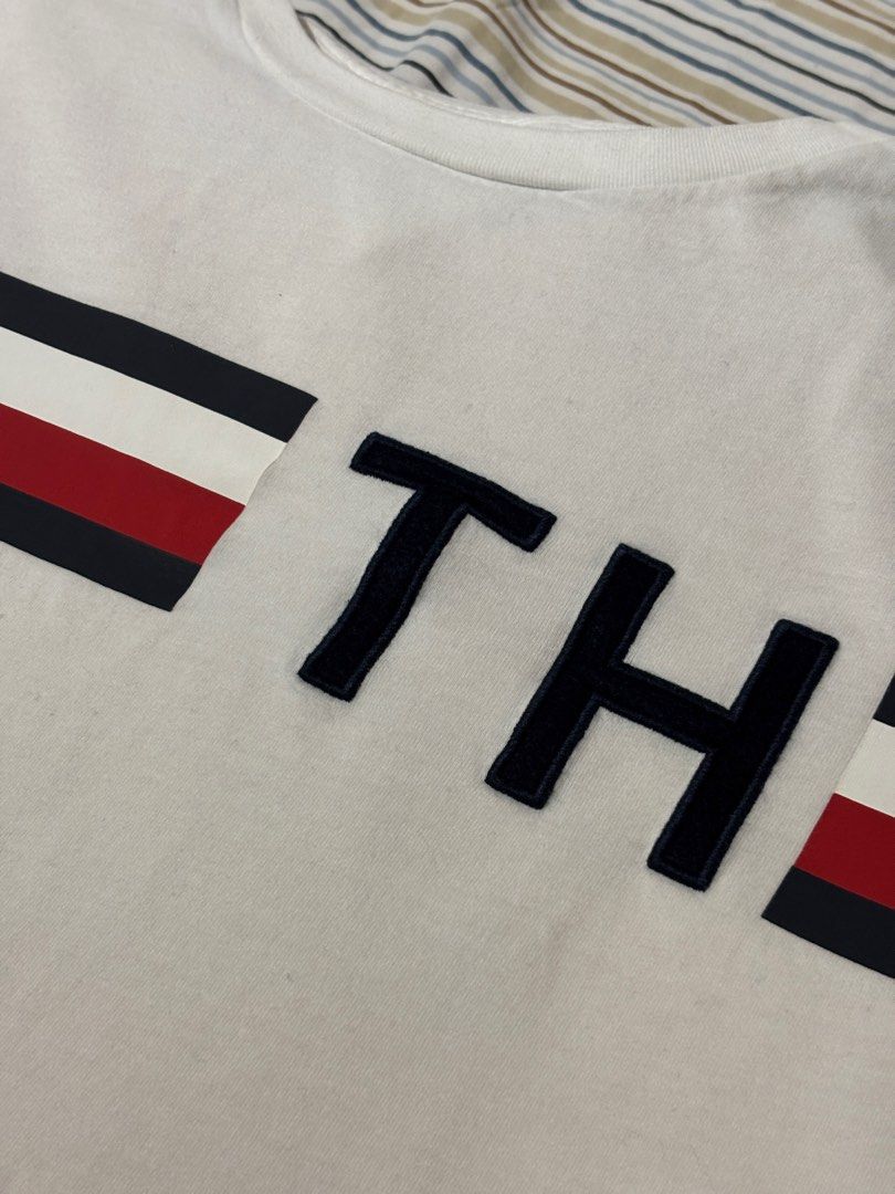 Tommy Hilfiger T-Shirt (Category: Tshirts & Polo Shirts ) located in Makati City. Submitted by justeprix (Listing ID 1428764966, Image 3). Description: Like new unisex Tommy Hilfiger T-shirt Authentic purchase from the US rfs: decluttering Size: Medium Chest: 51 cm Length: 64 cm Shoulder: 44 cm Sleeve: 20 cm Shipping from MAKATI CITY via Lalamove, Grab, Angkas Padala, etc. Booking will be set up by Juste Prix and cost will be shouldered by buyer.
