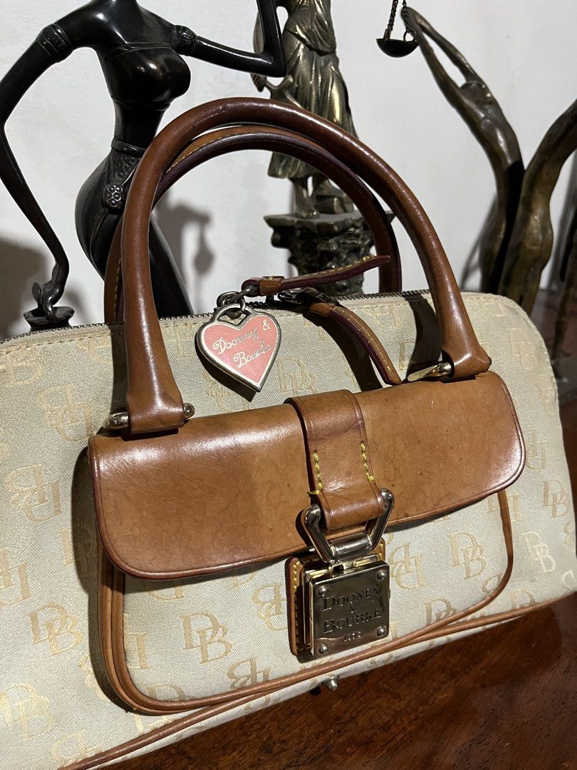 Vintage Dooney & Bourke Monogram Handbag (Category: Luxury Bags & Wallets) located in Quezon City. Submitted by bambibear19 (Listing ID 1428667387, Image 3). Description: well used canvas is aged and slightly worn at the edges stains on interior along zipper lock is functional ⋆‧°𓏲ּ𝄢 quezon city dm for details :).