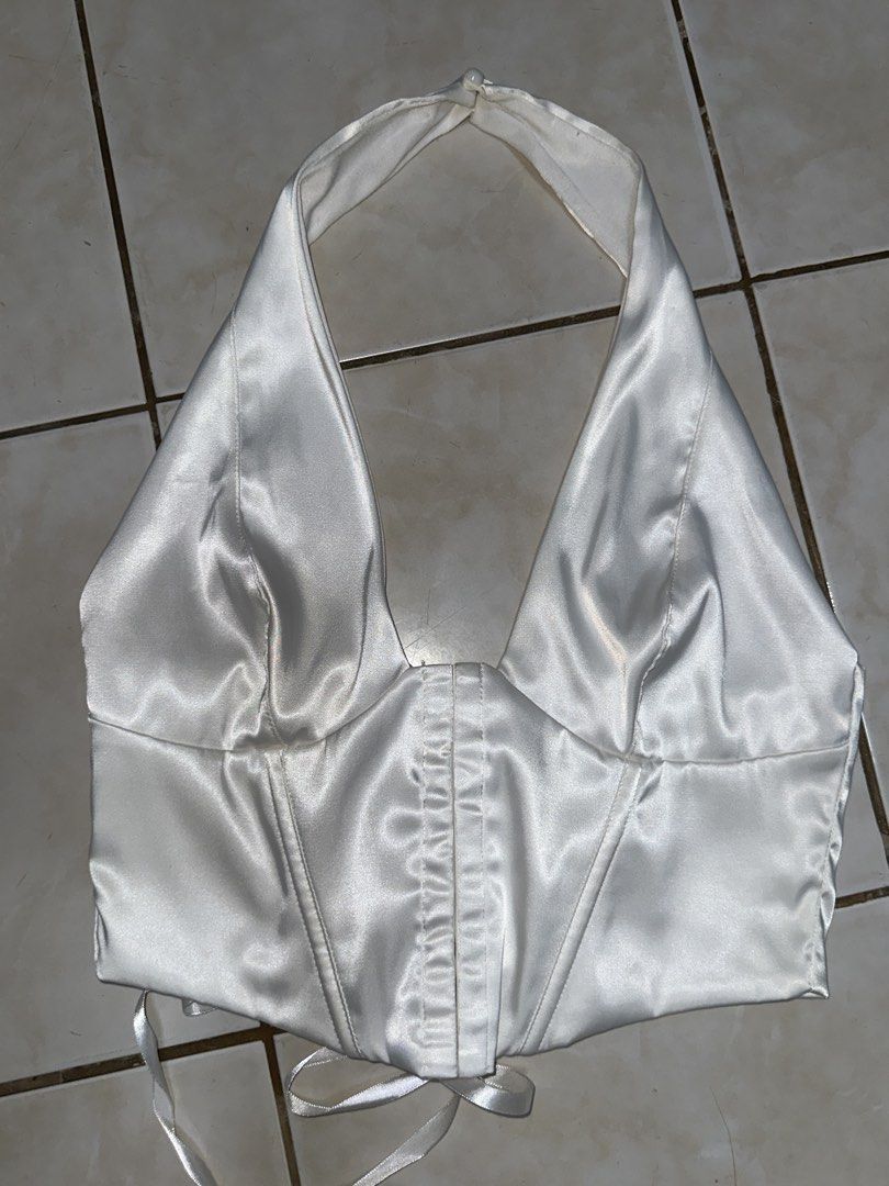 White Satin Halter Corset Top (Category: Sleeveless) located in Navotas City. Submitted by dr3ssto1mpress (Listing ID 1428653940, Image 1). Description: Rfs: not needed anymore, used once for performance Perfect for parties Corset top.