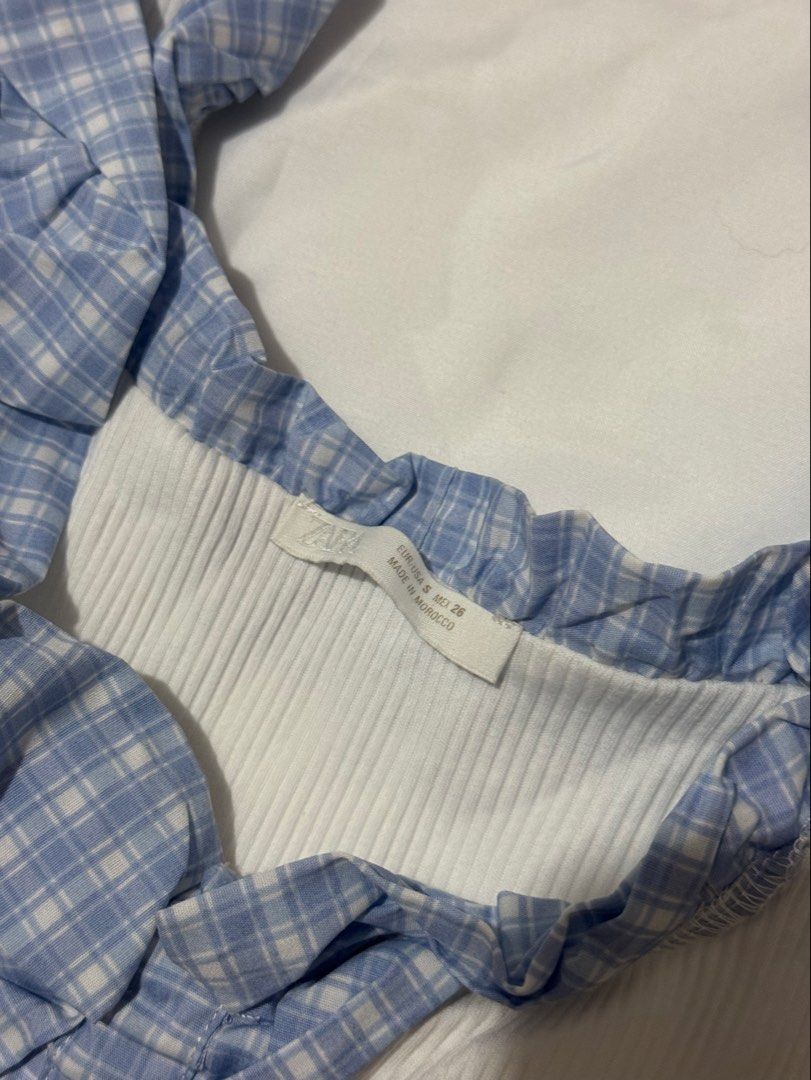 Zara Blue Ruffle Trim Tank Top (Category: Sleeveless) located in Cavite. Submitted by ellieschoice (Listing ID 1428618280, Image 2). Description: Got this in SM MOA for ₱1k+ Used once, no flaws For reference, I usually get xs sa zara pero hanggang small lang yung size for this top.