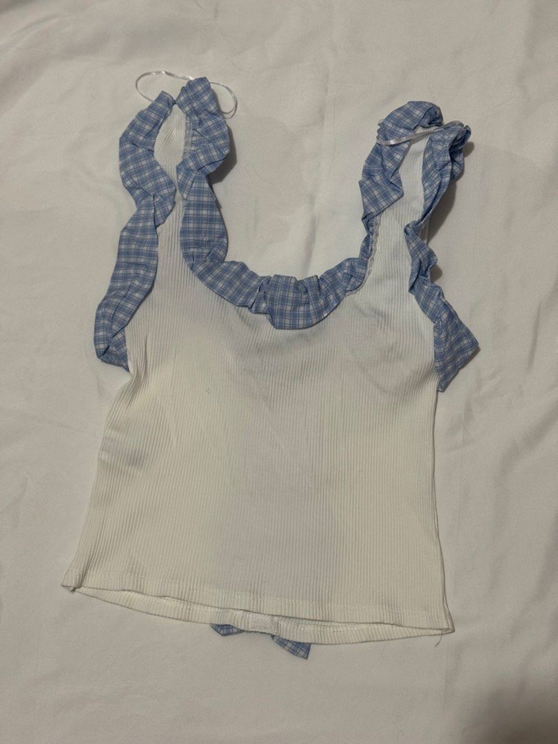 Zara Blue Ruffle Trim Tank Top (Category: Sleeveless) located in Cavite. Submitted by ellieschoice (Listing ID 1428618280, Image 3). Description: Got this in SM MOA for ₱1k+ Used once, no flaws For reference, I usually get xs sa zara pero hanggang small lang yung size for this top.