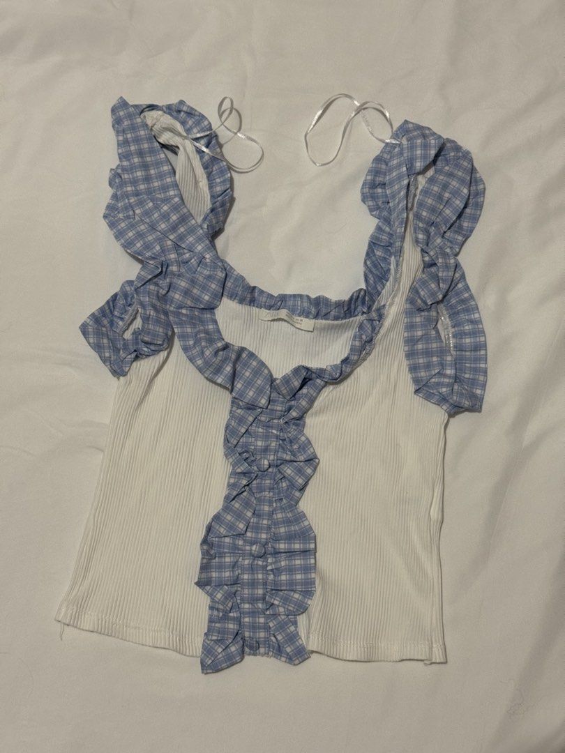 Zara Blue Ruffle Trim Tank Top (Category: Sleeveless) located in Cavite. Submitted by ellieschoice (Listing ID 1428618280, Image 1). Description: Got this in SM MOA for ₱1k+ Used once, no flaws For reference, I usually get xs sa zara pero hanggang small lang yung size for this top.