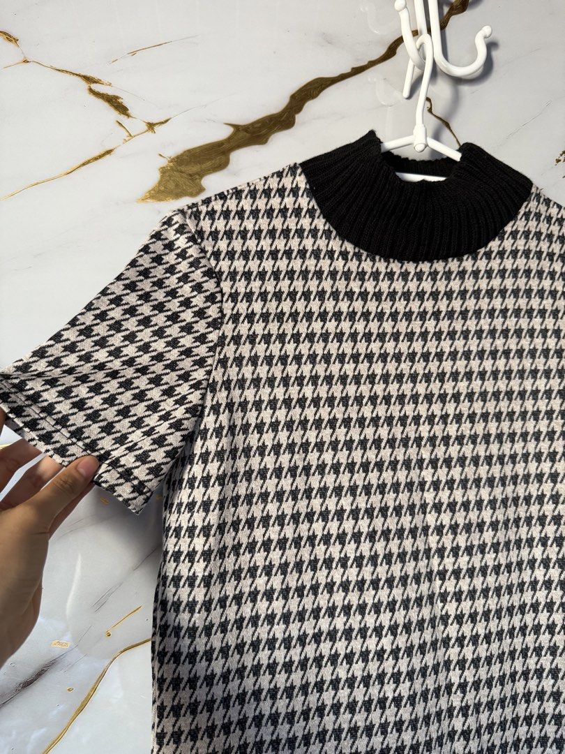 Zara Trafaluc Houndstooth Dress (Category: Dresses) located in Marikina City. Submitted by declutter_keni24 (Listing ID 1428695657, Image 2). Description: Super nice and lakas mkasosyal😍 Dress features a houndstooth pattern and a black ribbed turtleneck. It has short sleeves and two front pockets with black buttons. The dress is from Zara Trafaluc and has a size indicated on the label. The dress is a shift style..