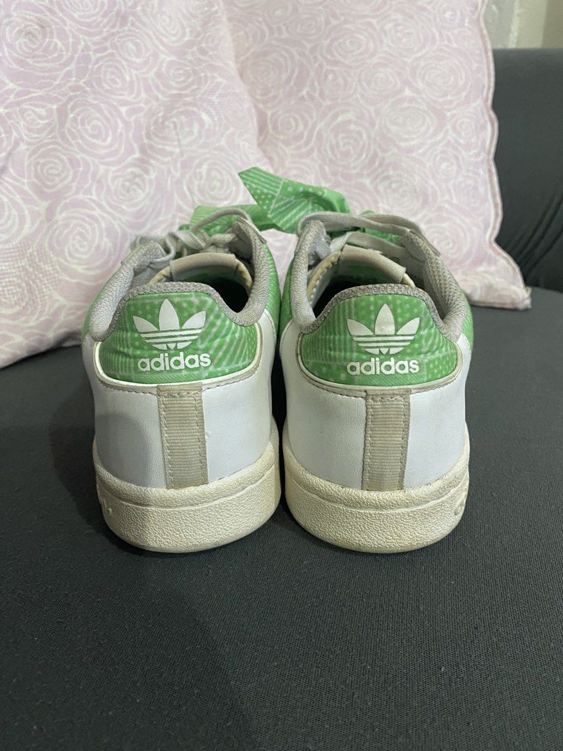 Adidas Continental 80s Green Sneakers (Category: Sneakers) located in Manila. Submitted by ayodizon (Listing ID 1428813014, Image 3). Description: Adidas Continental 80s sneakers in white and green. Features green accents on the sides and heel, with green patterned fabric tied as laces. The Adidas logo is visible on the tongue and heel. Size is US 6.5, UK 6, and FR 39 1/3. Made in Indonesia..