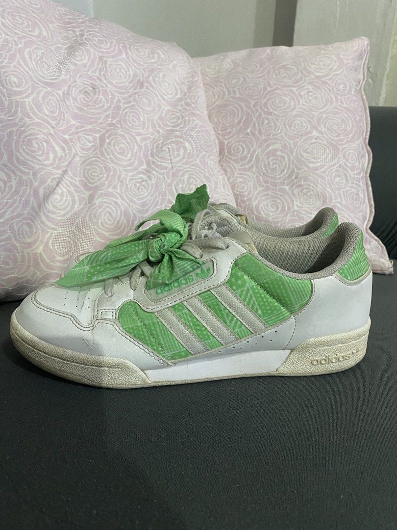 Adidas Continental 80s Green Sneakers (Category: Sneakers) located in Manila. Submitted by ayodizon (Listing ID 1428813014, Image 2). Description: Adidas Continental 80s sneakers in white and green. Features green accents on the sides and heel, with green patterned fabric tied as laces. The Adidas logo is visible on the tongue and heel. Size is US 6.5, UK 6, and FR 39 1/3. Made in Indonesia..