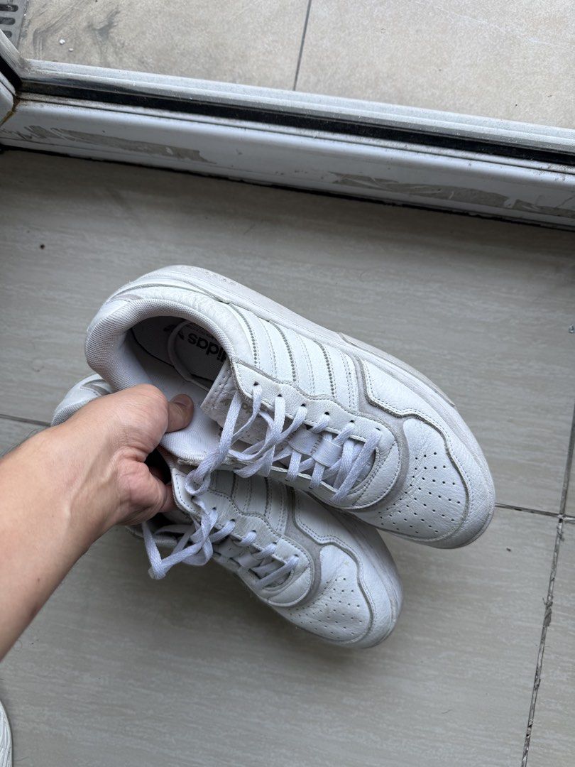 Adidas white shoes (Category: Sneakers) located in Manila. Submitted by decluttering0917 (Listing ID 1428867825, Image 2). Description: Used white adidas shoes for decluttering. RFS: not using anymore. Pasay MOA area.
