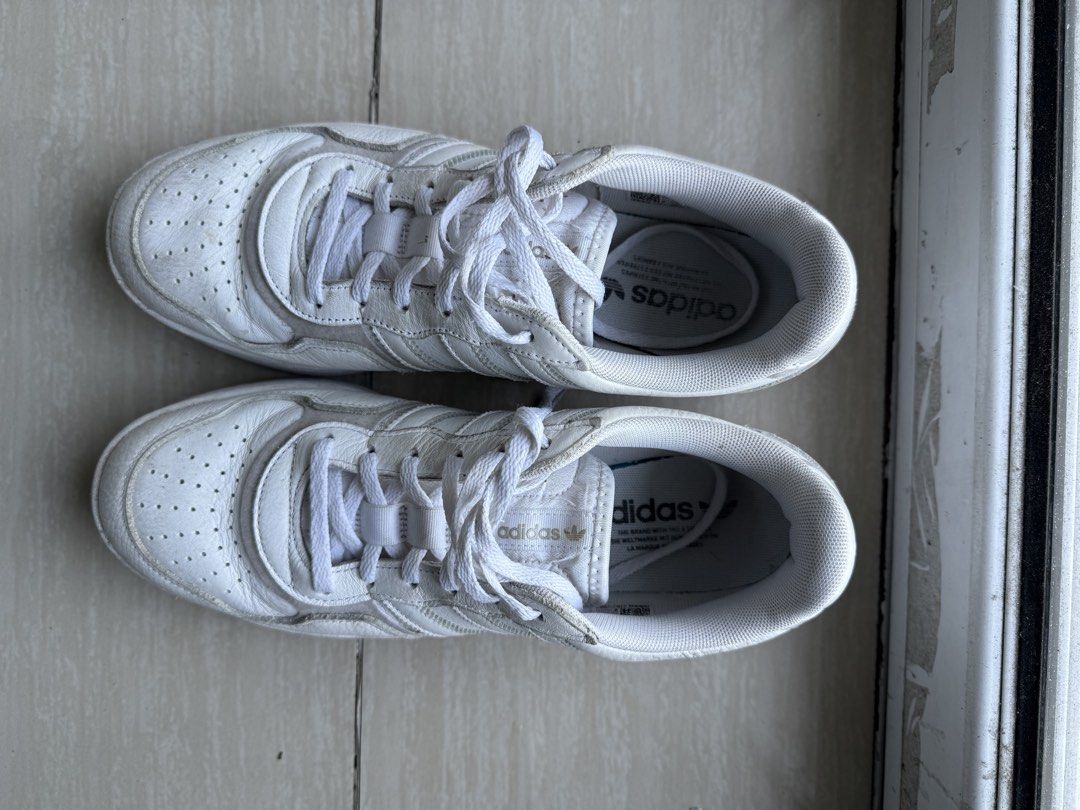 Adidas white shoes (Category: Sneakers) located in Manila. Submitted by decluttering0917 (Listing ID 1428867825, Image 1). Description: Used white adidas shoes for decluttering. RFS: not using anymore. Pasay MOA area.