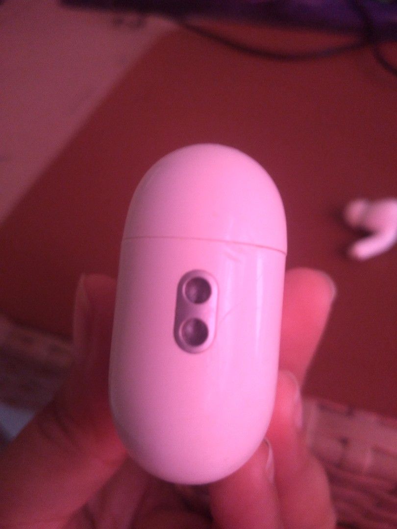 Apple AirPods Pro (Category: Earphones) located in Dasmarinas. Submitted by mspaupreloveditems (Listing ID 1428846023, Image 3). Description: Apple AirPods Pro 1st gen A2803 with charging case. The case has a button and a charging port. The earbuds are white and have a black mesh on the earbud. The case is marked "Designed by Apple in California Assembled in USA". issue: no left airpods no charger pwede sa andriod malakas ang sounds kahit right l
