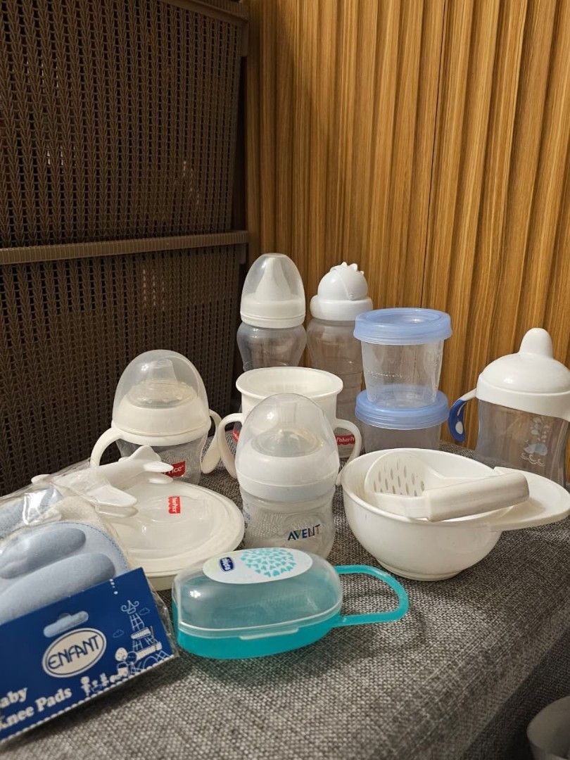Baby Feeding Bottles and Accessories Set (Category: Weaning & Toddler Feeding) located in Pasig City. Submitted by dayarama (Listing ID 1428828791, Image 2). Description: Set of baby feeding essentials including bottles, feeding bowls, and storage containers. Includes Avent and Chicco bottles, a Fisher-Price plate, and Enfant baby knee pads. Also includes a bowl with a strainer and a bottle case. Perfect for feeding your little one..