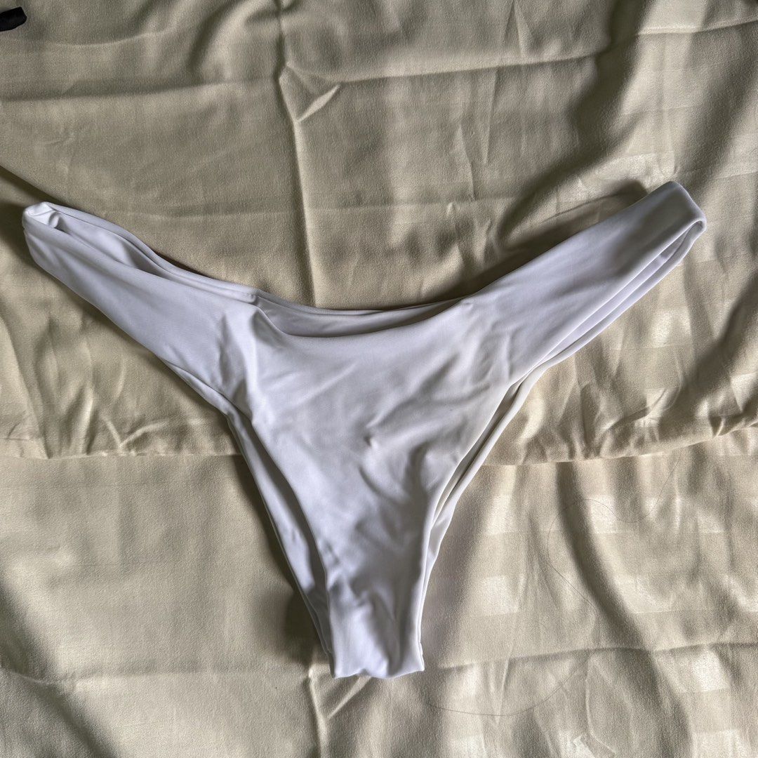 Black Bikini Top and White Bottom (Category: Bikinis & Swimsuits) located in Quezon City. Submitted by pamnly (Listing ID 1428897461, Image 2). Description: Never worn.