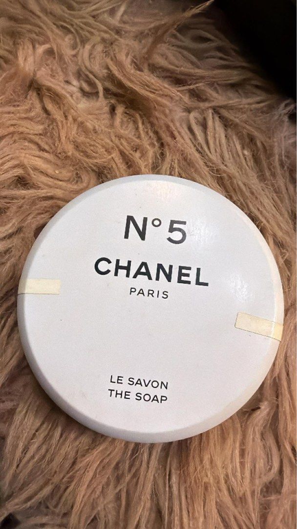 Chanel No. 5 The Soap (Category: Bath) located in Bacoor. Submitted by peanut_storm (Listing ID 1428834960, Image 1). Description: Chanel No. 5 The Soap. This is a round, white soap with the Chanel logo and "No. 5" printed on the front. It also says "Le Savon The Soap" on the front. The soap is in its original packaging..