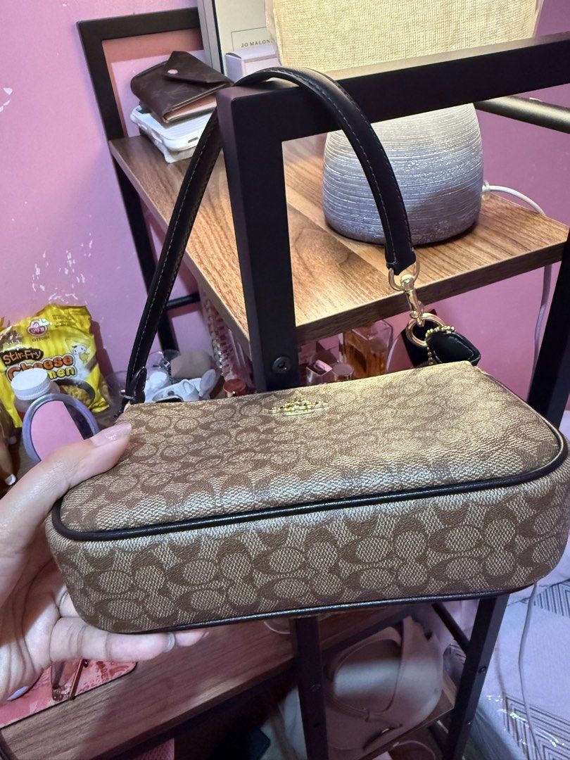 Coach Signature Nolita (Category: Luxury Bags & Wallets) located in Las Pinas. Submitted by emjey_ (Listing ID 1428983939, Image 2). Description: Dm if interested ☺️ authentic 💯 .