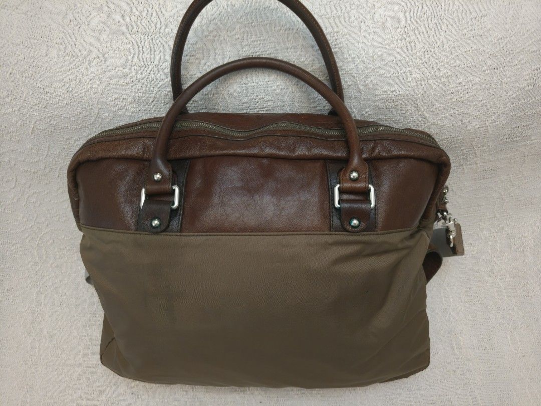 D&G Brown Leather and Nylon Bag (Category: Luxury Bags & Wallets) located in Makati City. Submitted by emem.pre.owned.ph (Listing ID 1428833608, Image 2). Description: - Dolce & Gabbana shoulder bag - Color: Brown - Multiple zippered compartments - Top handle - Detachable shoulder strap - Interior D&G logo - Material: Leather and nylon - Perfect for everyday use and travel.