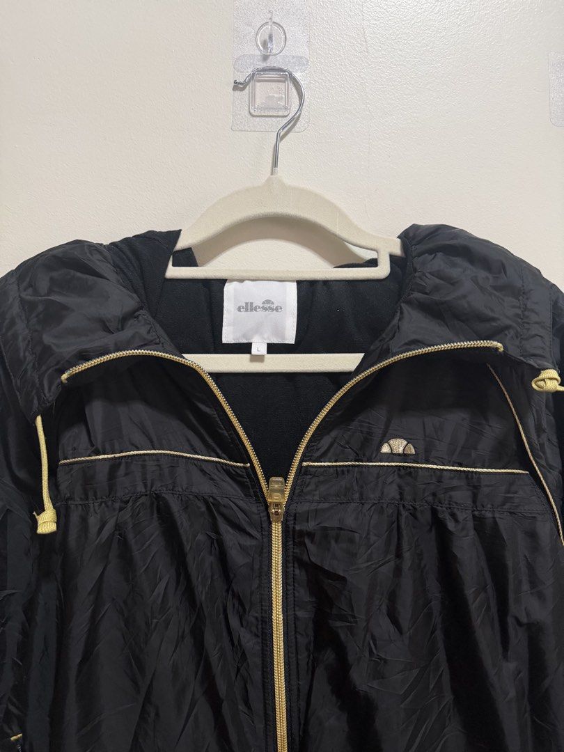18x24 Ellesse Black Jacket with Hood (Category: Coats, Jackets and Outerwear) located in Manila. Submitted by lookscoldoutwear (Listing ID 1428843908, Image 2). Description: ✨ Branded Secondhand Jacket / Hoodie ✔ Original / Authentic ✔ Good condition (no major issues) ✔ No stains / No holes (if applicable) ✔ Ready to wear 📏 Size and Dimes: M| 18x24 | Can fit also to Large 🎨 Color: Black 💰 (slightly negotiable for sure buyers) 📦 Location: Imus