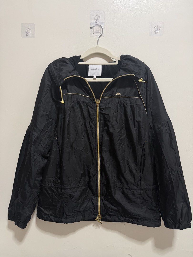 18x24 Ellesse Black Jacket with Hood (Category: Coats, Jackets and Outerwear) located in Manila. Submitted by lookscoldoutwear (Listing ID 1428843908, Image 1). Description: ✨ Branded Secondhand Jacket / Hoodie ✔ Original / Authentic ✔ Good condition (no major issues) ✔ No stains / No holes (if applicable) ✔ Ready to wear 📏 Size and Dimes: M| 18x24 | Can fit also to Large 🎨 Color: Black 💰 (slightly negotiable for sure buyers) 📦 Location: Imus