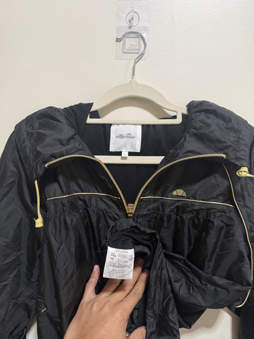 18x24 Ellesse Black Jacket with Hood (Category: Coats, Jackets and Outerwear) located in Manila. Submitted by lookscoldoutwear (Listing ID 1428843908, Image 3). Description: ✨ Branded Secondhand Jacket / Hoodie ✔ Original / Authentic ✔ Good condition (no major issues) ✔ No stains / No holes (if applicable) ✔ Ready to wear 📏 Size and Dimes: M| 18x24 | Can fit also to Large 🎨 Color: Black 💰 (slightly negotiable for sure buyers) 📦 Location: Imus