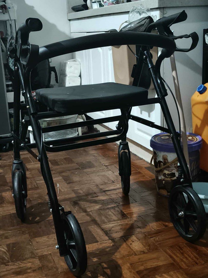 Foldable Black Walker with Seat (Category: Wheelchairs) located in Manila. Submitted by jny.selling (Listing ID 1428862043, Image 3). Description: Negotiable ,, foldable walker with seat n utility box under .