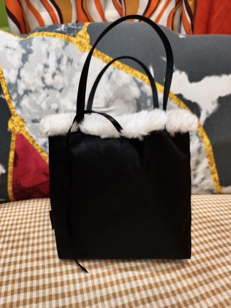 Givenchy Black Tote Bag with Fur Trim (Category: Luxury Bags & Wallets) located in Digos. Submitted by emmanuel28 (Listing ID 1428936166, Image 3). Description: Authntic Y2K Satin tote with Fur Rhinestones logo Fur material inside for extra comfort for your items especially phones and wallets Size (approx.) Height 18cm, Width 18cm, Depth 8.5cm Handle height: 13cm from the bag Rank SA No issue Location: Davao del sur Buyer shoulders shipping fee.