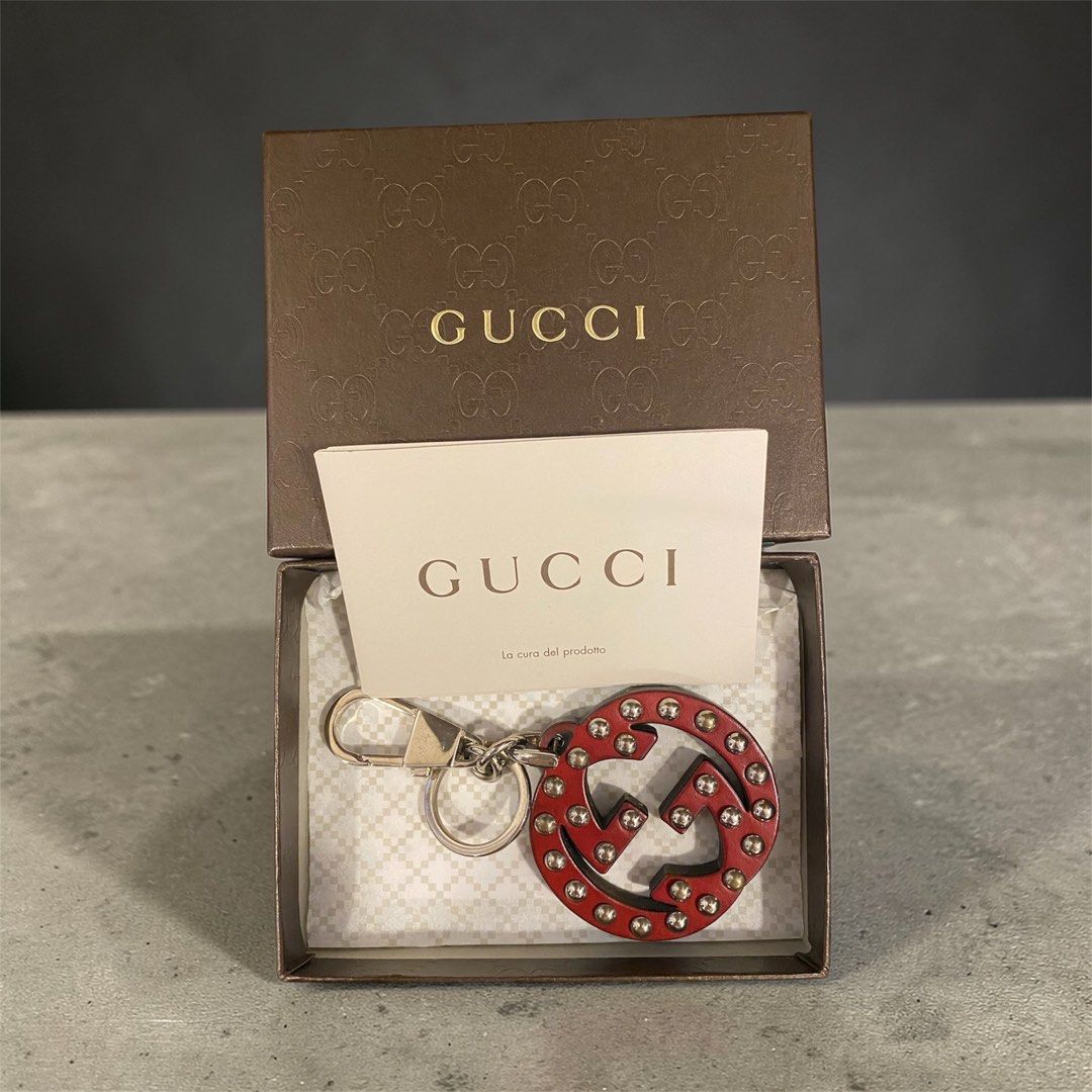 Gucci Red Leather Keychain (Category: Luxury Accessories) located in Mandaluyong City. Submitted by loved_curated (Listing ID 1428825825, Image 1). Description: Authentic Gucci keychain featuring a red leather design with the iconic interlocking G logo. It comes with its original box and authenticity card. The keychain has silver-tone hardware and a secure clasp. A stylish accessory to add a touch of luxury to your keys or bag..