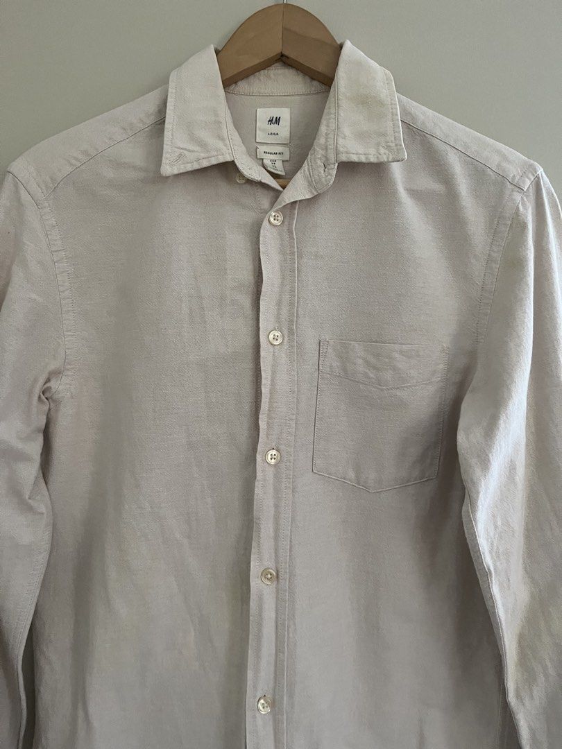 H&M Light Khaki Oxford Button-down Shirt (Category: Formal Shirts) located in Quezon City. Submitted by reviverevolution (Listing ID 1428880075, Image 1). Description: - H&M Oxford Button-down Shirt - Color: Light Khaki - Size: XS (Men’s size) - Measurement: Pit to pit 19 inches; length 26 inches - Payment Methods: GCash / BPI / BDO - Delivery via LBC / J&T pick-up / Lalamove pick-up. Delivery fee and pick-up booking c/o buyer. - All sales are fi