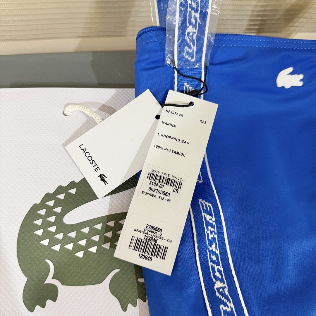 Lacoste Shopping Bag - Brand New (Category: Tote Bags) located in Rizal. Submitted by mausan (Listing ID 1428870601, Image 3). Description: Lacoste Shopping Bag Brand New Color: Marina (Blue) Original Price: P6,200 ($104) Sale Price: P2,900 RFS: Bought too many bags .