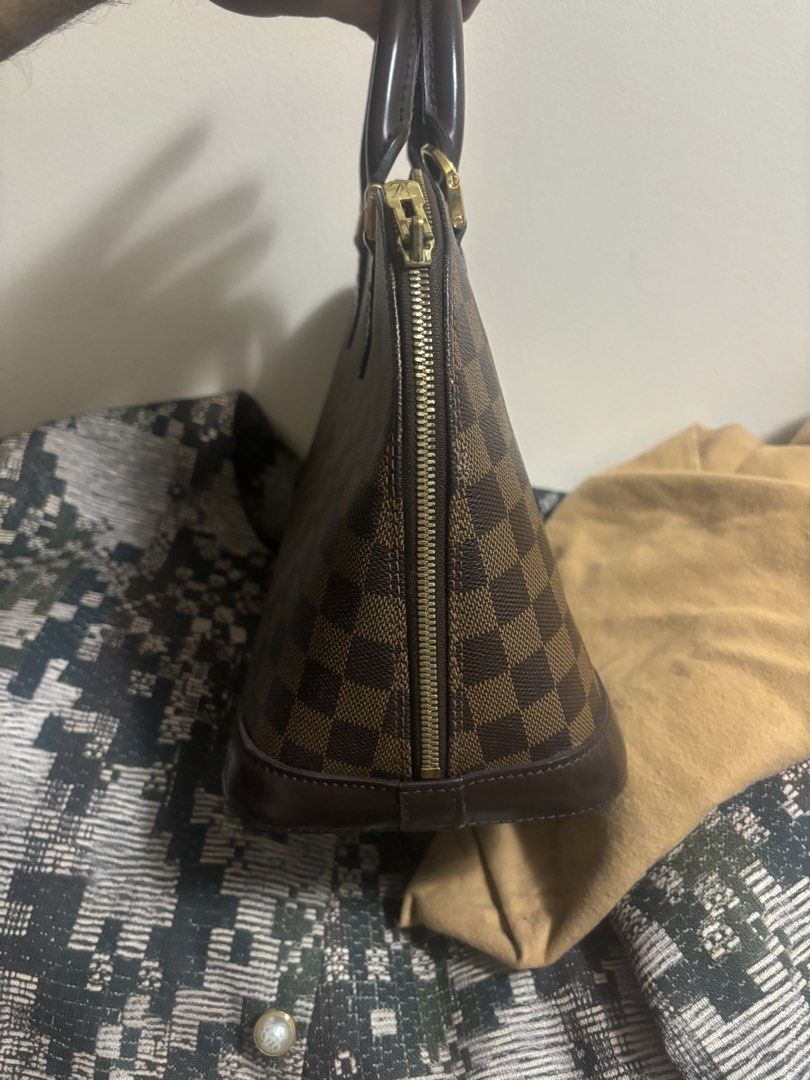 Louis Vuitton Alma Damier Ebene Handbag (Category: Luxury Bags & Wallets) located in Angeles City. Submitted by anythingonlineph (Listing ID 1428983238, Image 3). Description: No more box, just the dustbag. Prestine condition overall, check the uploaded photos. Bawal sa walang budget or middleman, strictly direct buyer-seller transactions only. I do not meet up anymore, super daming flakers at paawa effects upon meeting up. LalaMove same day deli