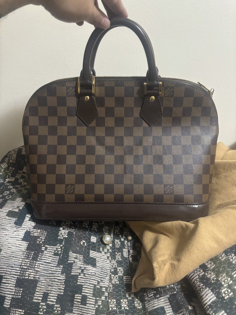 Louis Vuitton Alma Damier Ebene Handbag (Category: Luxury Bags & Wallets) located in Angeles City. Submitted by anythingonlineph (Listing ID 1428983238, Image 1). Description: No more box, just the dustbag. Prestine condition overall, check the uploaded photos. Bawal sa walang budget or middleman, strictly direct buyer-seller transactions only. I do not meet up anymore, super daming flakers at paawa effects upon meeting up. LalaMove same day deli