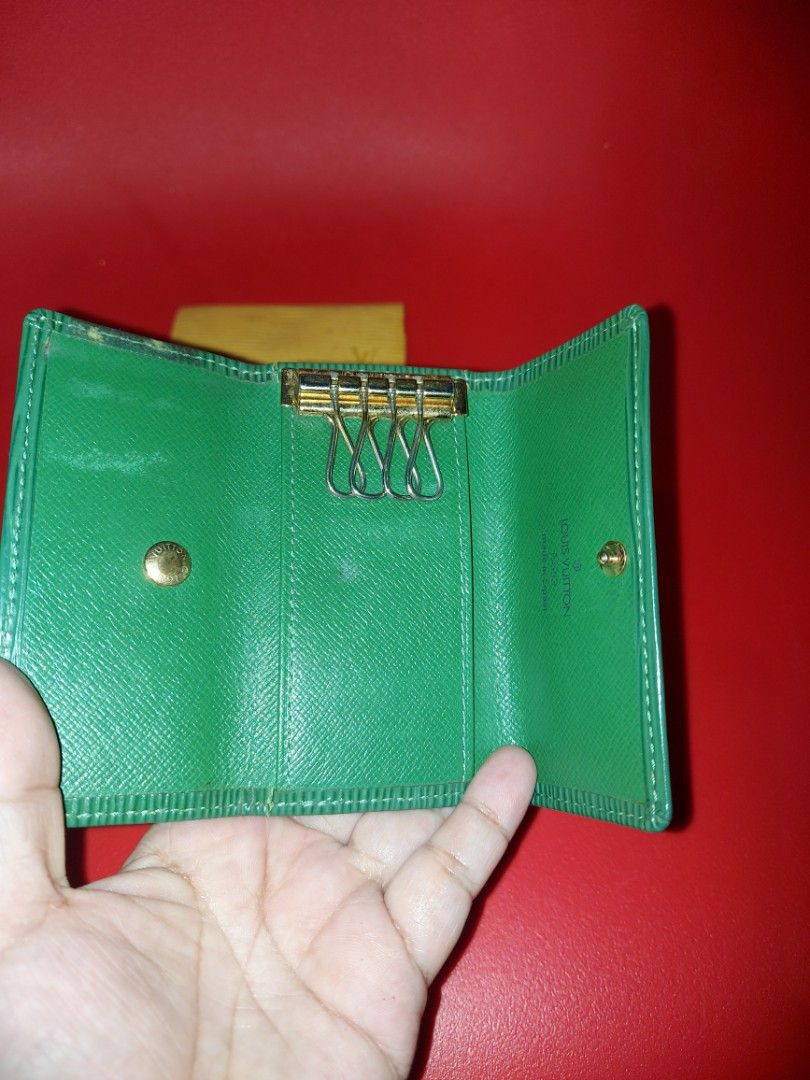 Louis Vuitton Key Holder bundle 2pcs (Category: Luxury Bags & Wallets) located in Quezon City. Submitted by threetwotwo2ndaccount (Listing ID 1428794714, Image 2). Description: Authentic Louis Vuitton key holder. Features a green Epi leather exterior and a snap closure. The interior has key rings and a snap closure. Includes a dust bag. The key holder is made in Spain..