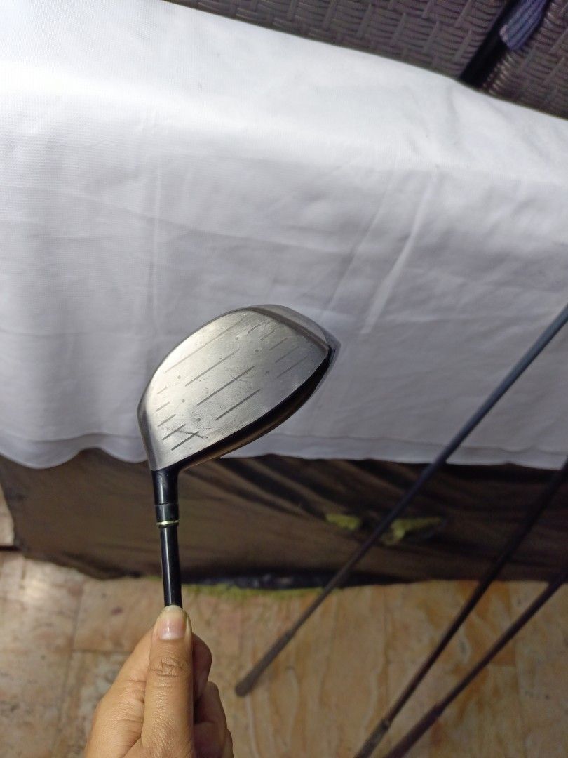 Maruman EXIM Nano Fullerene Titanium Driver (Category: Golf) located in Manila. Submitted by yeonmei5614747 (Listing ID 1428847505, Image 2). Description: Maruman EXIM Nano driver with a 10-degree loft. Features Fullerene Titanium technology. The shaft is labeled EXIM SECT X02. The grip is black. The club head shows some signs of use..
