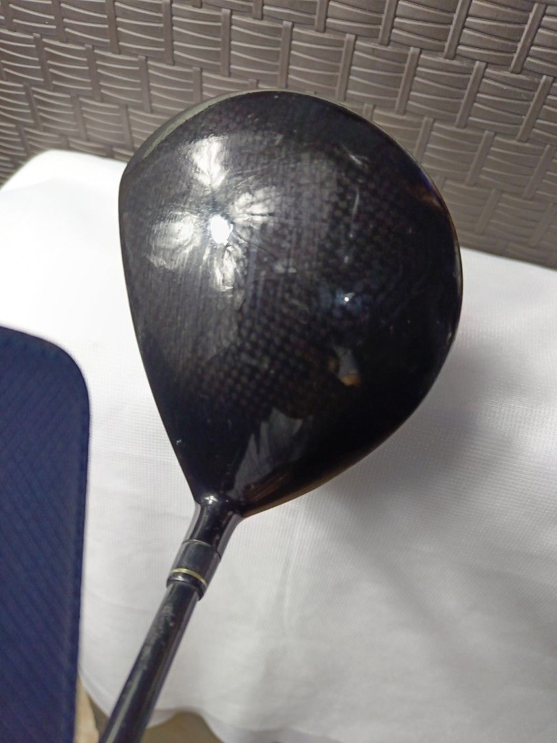 Maruman EXIM Nano Fullerene Titanium Driver (Category: Golf) located in Manila. Submitted by yeonmei5614747 (Listing ID 1428847505, Image 3). Description: Maruman EXIM Nano driver with a 10-degree loft. Features Fullerene Titanium technology. The shaft is labeled EXIM SECT X02. The grip is black. The club head shows some signs of use..